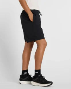 NEW BALANCE - PANTALONCINO UOMO NERO E CELESTE ESSENTIALS LINED GRAPHIC - MS41238BM