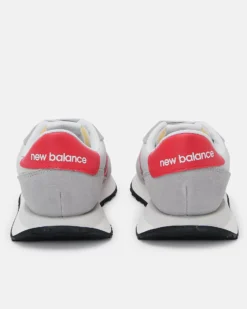 NEW BALANCE - Sneakers da uomo grigia e rossa con dettagli scamosciati - 237