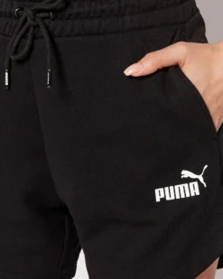 PUMA - Pantaloncini corti da donna neri a vita alta con logo bianco