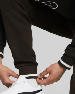 PUMA - Pantalone tuta da uomo nero con logo verde bianco