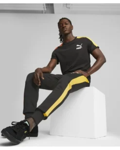 PUMA - Pantalone tuta da uomo nero con elastico alla caviglia e bande laterali