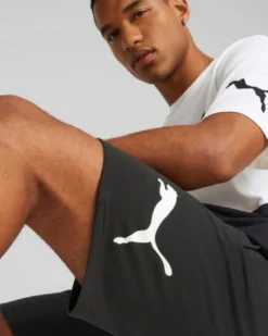 PUMA - Pantaloni corti da uomo neri con logo bianco