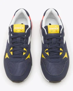 PUMA - Sneakers blu e bianca con dettagli rossi e gialli, numerata 36/39 - N 92 GS