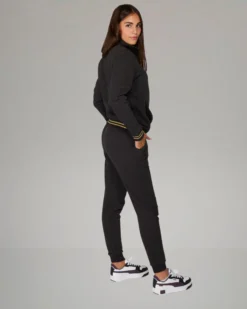 PUMA - TUTA COMPLETA NERA ESSENTIAL+ GLITTER FZ SUIT FL  DA DONNA ,  684764-01